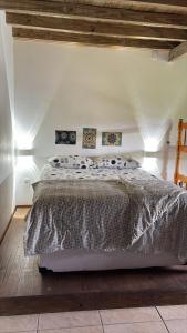 a bedroom with a large bed in a room at Quinta Di Crivelli in Praia do Rosa +73 photos