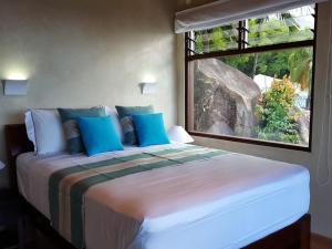 Postel nebo postele na pokoji v ubytování Villas Palm Royal