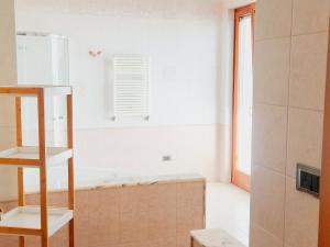 a bathroom with a bath tub in a room at Dimora Il Roseto in Trani +16 photos