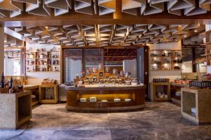 a bar in a room with a lot of shelves at The Soaltee Kathmandu, Autograph Collection in Kathmandu