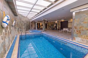 a swimming pool in a house with a swimming pool at Al Muhaidb Residence Al Takhasossi 2 - Economic in Riyadh
