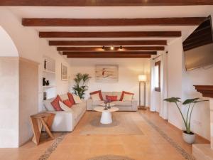 a living room with a couch and a table at Casa "Valldemossa Paradise" in Valldemossa