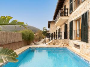 a swimming pool in front of a building at Casa "Valldemossa Paradise" in Valldemossa