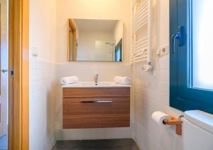 a bathroom with a sink and a mirror at Apartaments Rural Montseny in gualba de Dalt +47 photos