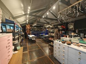 a room with a store with a lot of products at 1 Bed in Bude oc-s34846 in Bude