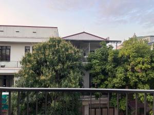 a white building with trees in front of it at Mom's home in Ninh Binh