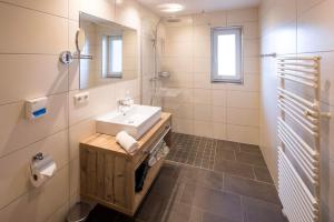 a bathroom with a sink and a mirror at Appartement Moaeben in Alpbach