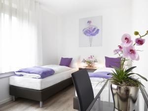 Ένα ή περισσότερα κρεβάτια σε δωμάτιο στο Hotel Hegemann garni