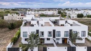 an aerial view of a white house at Stylish Central Three Bed Duplex with Private Pool in Flic-en-Flac
