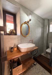 a bathroom with a sink and a mirror at Happy House Progled in Progled +28 photos