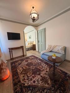 a living room with a couch and a table at Happy House Progled in Progled