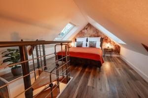 a bedroom with a bed in a attic at Design Loft mit Whirlpool - Einzigartig & Citynah in Krefeld