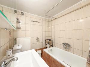 a bathroom with a tub and a toilet and a sink at Stone Haven & Garden near the Sea in Methoni +44 photos