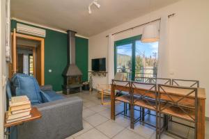 a living room with a couch and a table at Apartaments Rural Montseny in gualba de Dalt