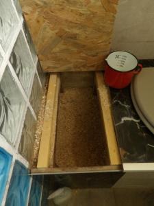 a bathroom with a toilet and some dirt in the floor at Mas cantecou in Mosset +27 photos