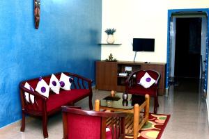 TV a/nebo společenská místnost v ubytování Holidayincoorg Cozy Nest
