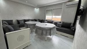 a living room with a couch and a table at Selouane in Selouane +4 photos