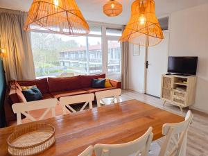 a living room with a couch and a table at Vakantie appartement Chava WE09 in Westkapelle