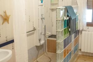a bathroom with a shower and a sink at Casa Rural RosaVera in Ossa de Montiel +72 photos