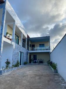 a view of a house with a patio at Ramos hotel in Barreirinhas