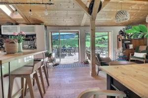 a kitchen and dining room with a table and chairs at L annexe in Saint-Jean-d'Aulps