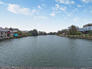 a view of a river with houses and buildings at Pembroke Lake House in Pembroke