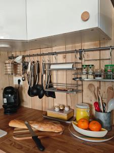 a kitchen counter with a plate of food and utensils at Le Clos de Saint Georges in Saint-Georges-dʼOléron +30 photos