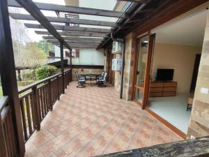 a patio with a table and chairs on a balcony at Santa Marina Breeze - One bedroom apartment in Sozopol