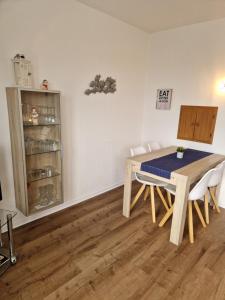 a dining room with a table and chairs at Appartementhaus Diana in Grömitz