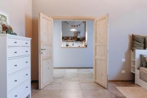 a room with an open door with a bedroom at La Cocca Home in Bellinzago Novarese +24 photos