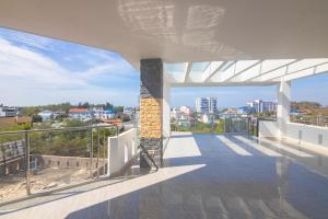 a balcony with a view of a city at Khách sạn Ngọc Anh in Long Hai