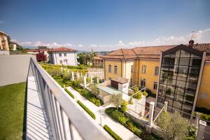 a view from the balcony of a building at Maison Selva - Corte Brunati Villetta Deluxe con piscina e garage in Salò