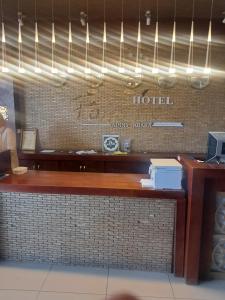 a hotel sign on the wall of a restaurant at Foyat Hotel in Addis Ababa