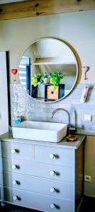 a bathroom with a sink and a mirror at 't Herenhoes in Neerpelt