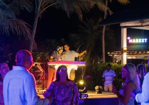 a group of people at a party at night at Joy Island Maldives All Inclusive Resort in Male City +289 photos