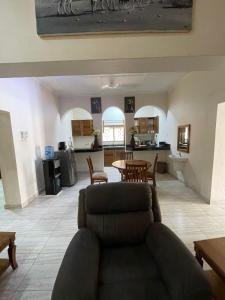 a living room with a couch and a table at Mtwapa- North Coast in Mtwapa