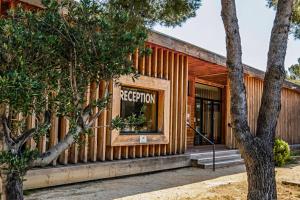 a store front of a building with a reception window at Camping l'Arquet - Mobil-home Premium 4 pièces 6 personnes climatisé MAE-3771 in Martigues +38 photos