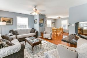 a living room with couches and a table at Shop, Dine, Unwind! Family Home in Dtwn Bar Harbor in Bar Harbor
