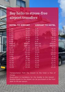 a red sign in front of a building at Ramada by Wyndham Amsterdam Airport Schiphol in Badhoevedorp