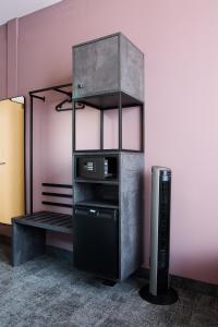 a room with a desk with a computer on a shelf at Hotel Elsen in Grevenbroich +24 photos