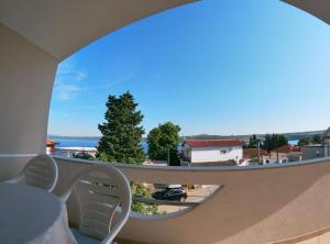 a view from a balcony with a view of a street at Sanja Apartments Posedarje in Posedarje