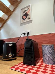 a desk with a phone on top of a table at Le cocon des Sacres in Reims +12 photos