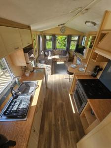 an aerial view of a kitchen and living room in a caravan at Westfield 75 in Skipsea