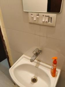 a bathroom with a sink with a faucet at Punawale tathwade 1bhk in Méribel Village