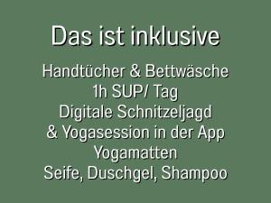 a sign with the words das list inclusive handwriting and legitimacy in sipip tag at 360 Grad by teamgeist Apartmenthaus - familienfreundlich - direkt am See mitten im Naturpark - Wassersportaktivitäten vor Ort in Kolberg