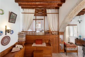 a room with a bed and a large mirror at Traditional Dream House in Soroni