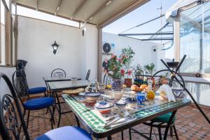 a dining room with a table and chairs at Riad Jasmine in Rabat +34 photos