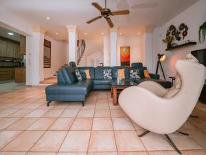 a living room with a couch and a table at Villa in Cala Llonga near Beach & Ferry Port in Cala Llonga