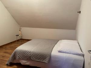a bedroom with a bed in a room at Escapade in Soulaines-Dhuys