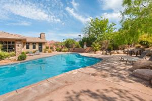 a swimming pool in the backyard of a home at Ohana Nest condo in Hurricane +25 photos